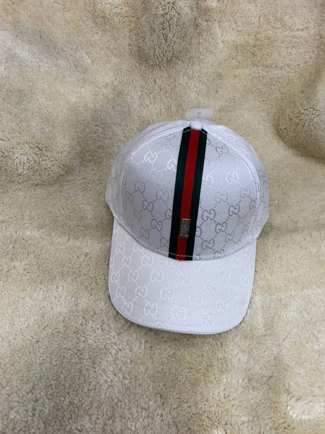 GUCCI ALL OVER EMBOSED STRIPE BUCKLE CAP